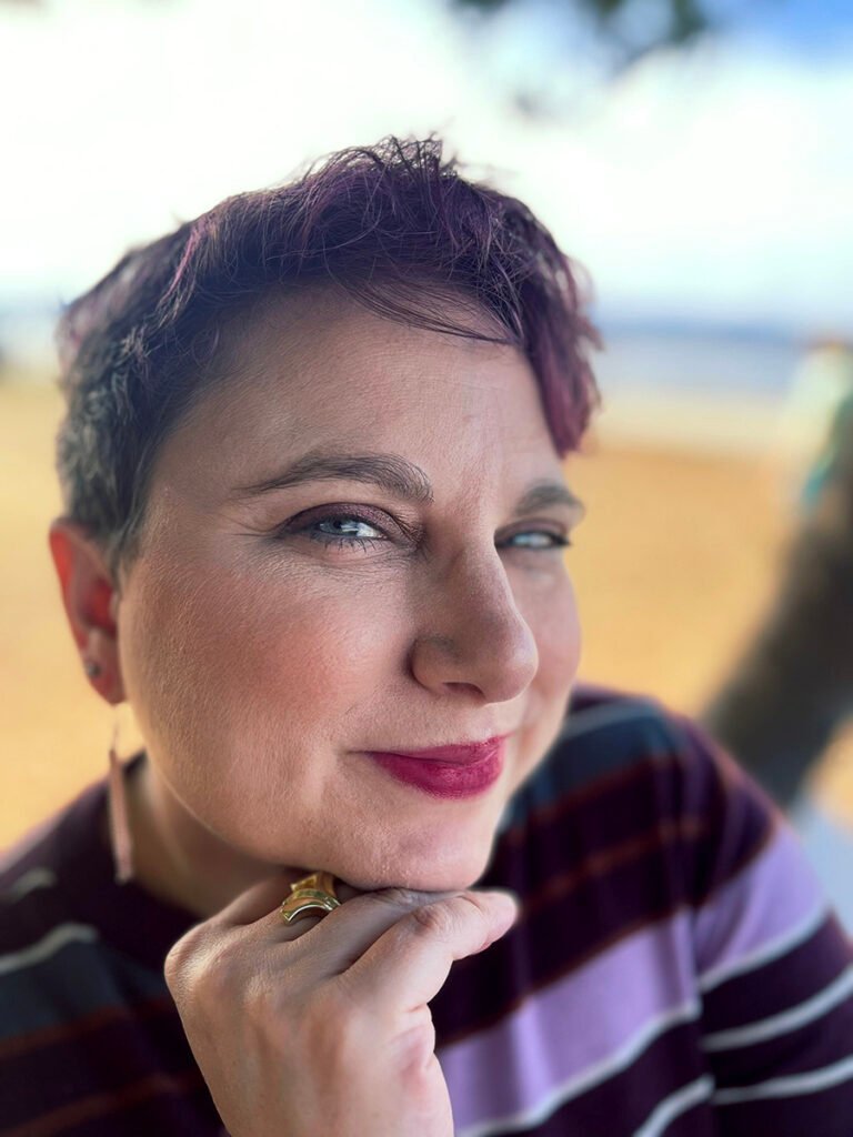 Helen Sernett posing with her hand on her chin.