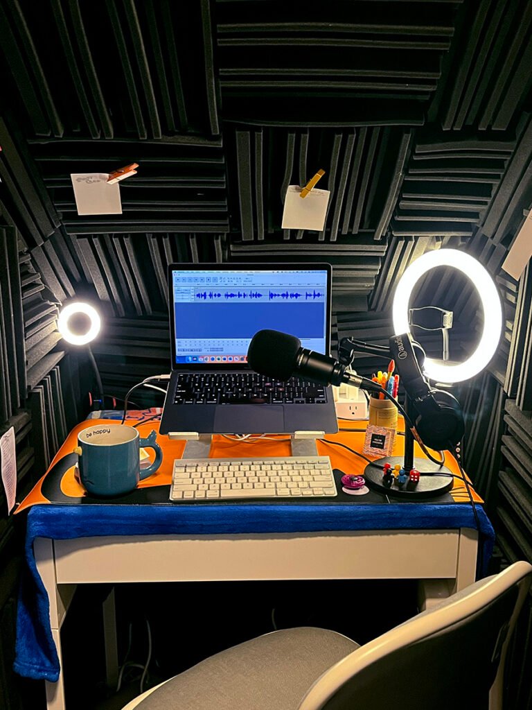 Helen's home studio with microphone, ring lighting and soundproofing.